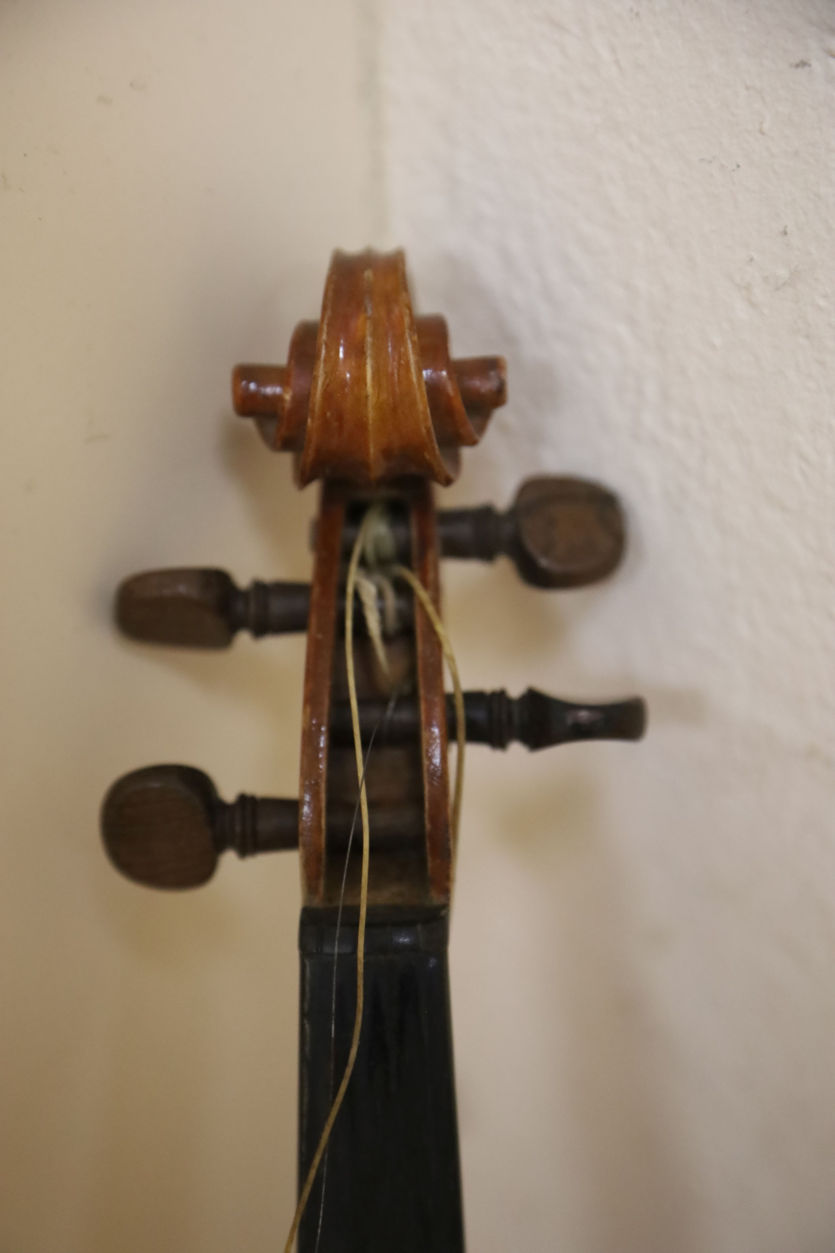 A Stradivarius copy violin and two bows and another bow, both cased, backs 33cm and 30cm